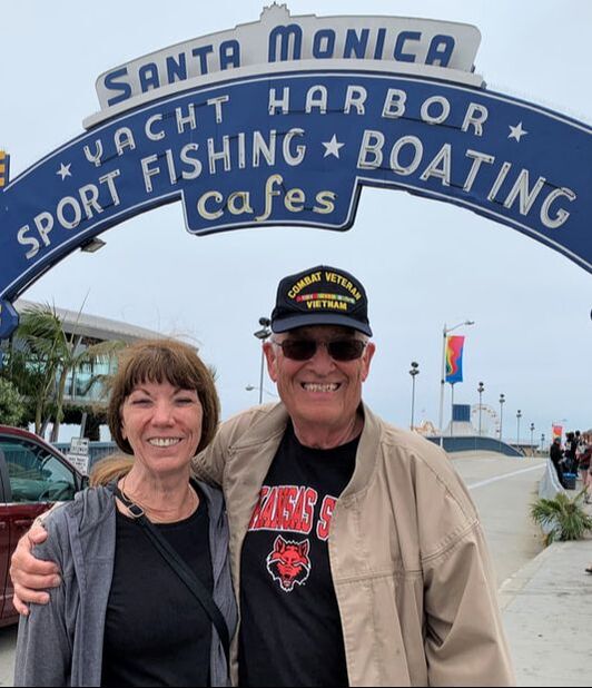 Picture of Herb and Bev Sennett standing in front of the entrance to the Santa Monica, California, Yacht Harbor and Pier.